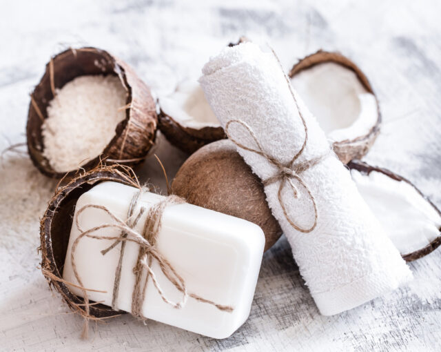 spa-still-life-organic-cosmetics-with-coconuts-light-wooden-background-body-care-concept organic coconut oil soap